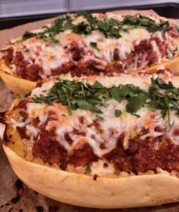 This gluten-free spaghetti squash lasagna recipe will be your new BFF. Tasty spaghetti squash tossed with garlicy greens, two kinds of cheese & savory meat sauce. So ridiculously good! | www.grownupdish.com