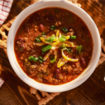 This Veggie Loaded Chili recipe is sugar-free and gluten-free. For Whole30, paleo or keto versions omit the beans. Make a big pot today and thank me later. | www.grownupdish.com