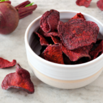 Homemade beet chips have all the crunchy satisfaction of a potato chip with none of the guilt. And they are ridiculously easy to make with this easy recipe. | www.grownupdish.com